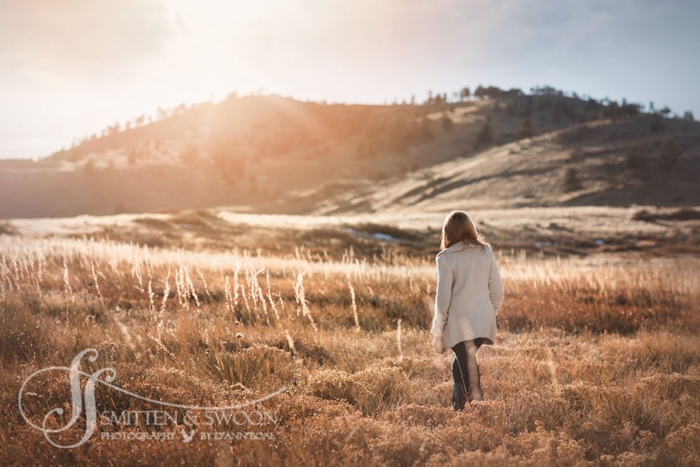 11 year old portrait of girl walking through golden field at sunset {boulder portrait photographer}