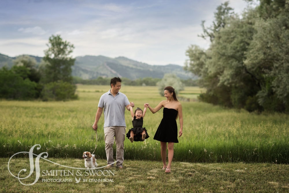 family of three swinging baby in air {boulder family photographer}